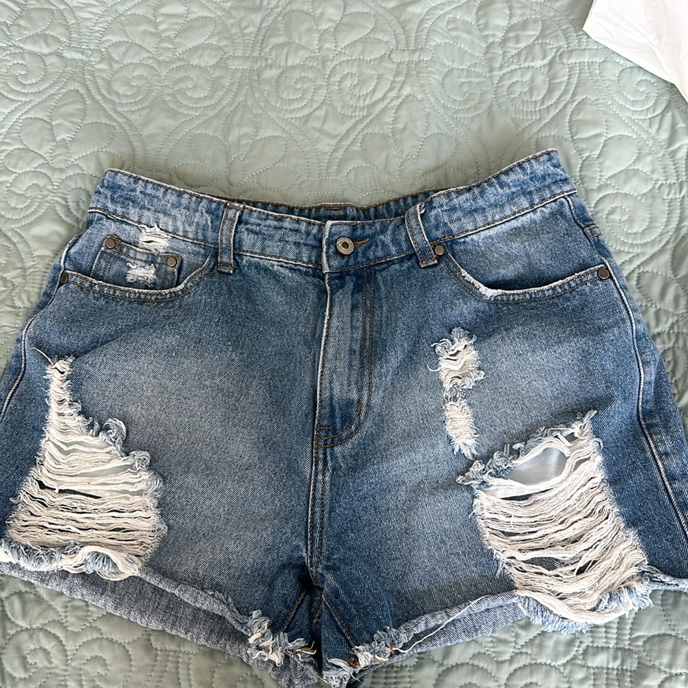 Women’s denim ripped shorts. Size M.